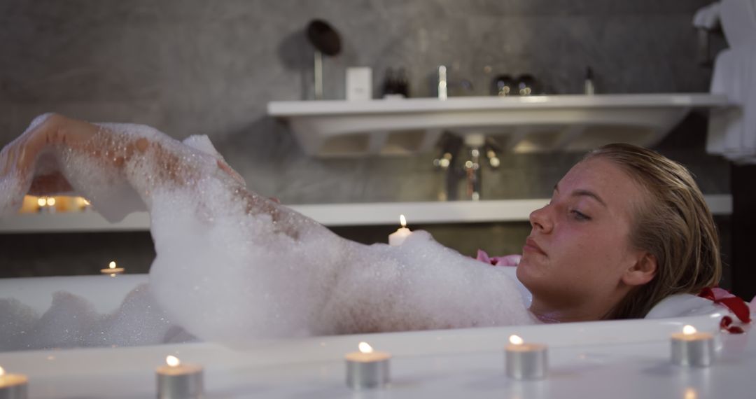 Woman Relaxing in Candlelit Bubble Bath - Free Images, Stock Photos and Pictures on Pikwizard.com