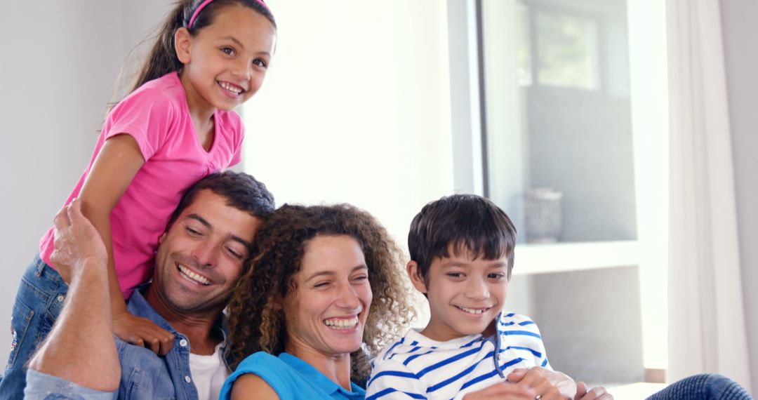 Happy Multiracial Family Laughing Together at Home - Free Images, Stock Photos and Pictures on Pikwizard.com