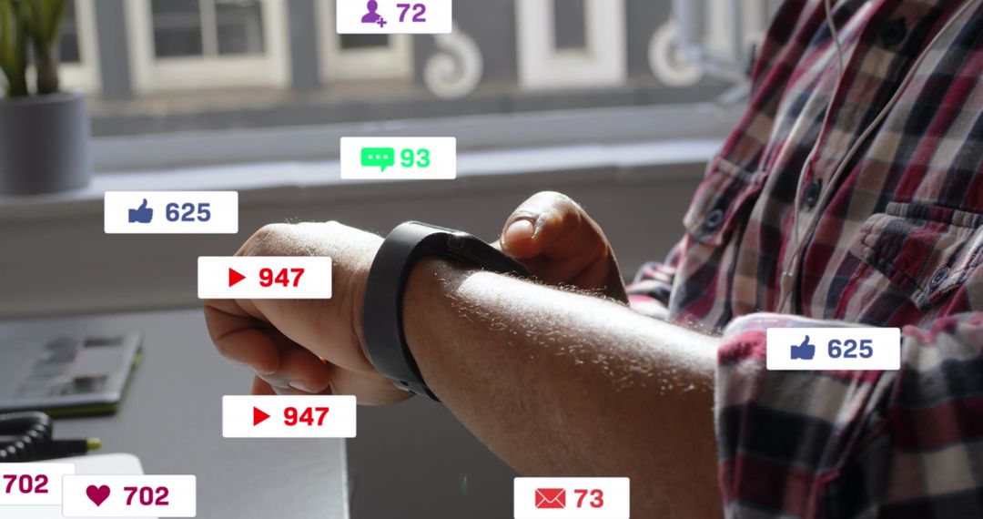 Man Checking Smartwatch with Social Media Icons Overlay