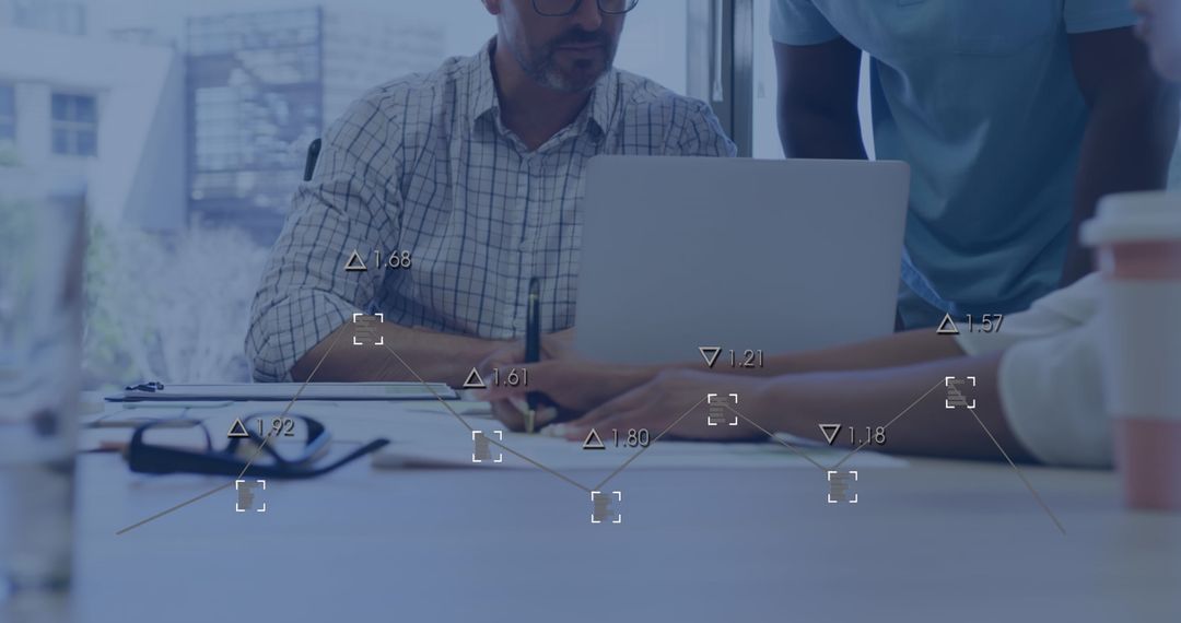 Business Team Analyzing Digital Data in Office Environment