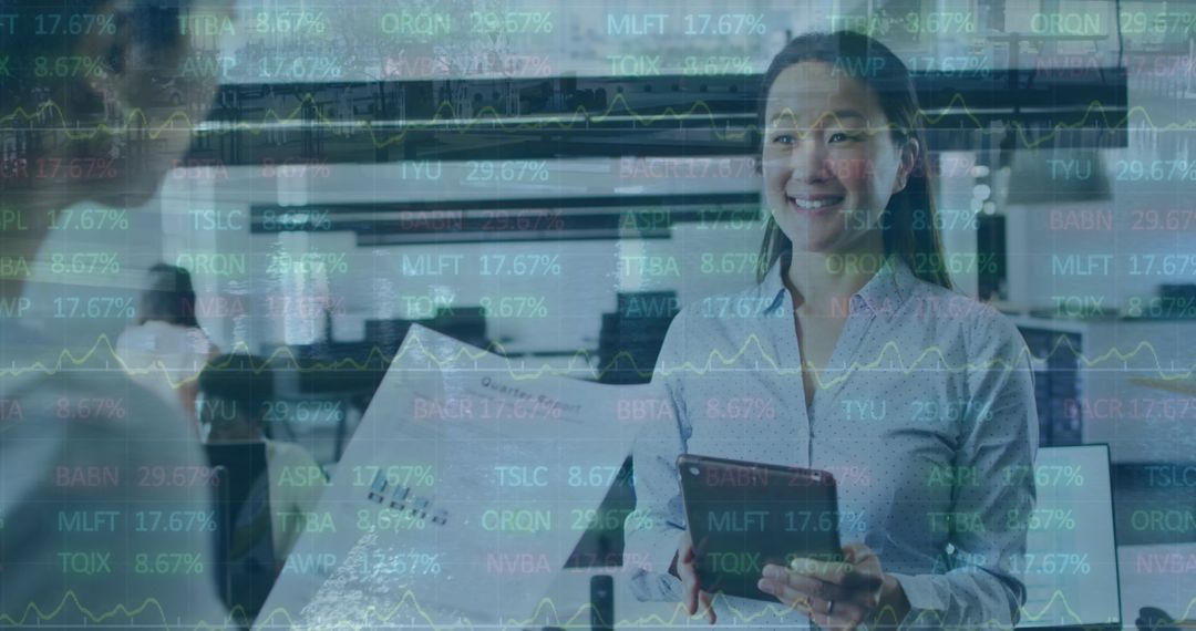 Coworkers Analyzing Stock Market Data on Tablet in Modern Office