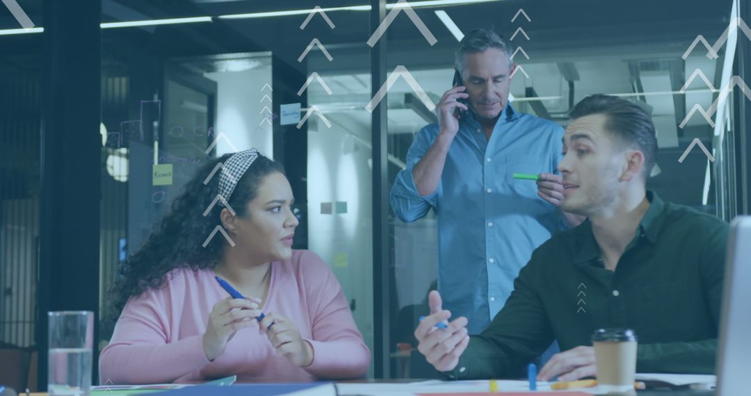 Team Analyzing Data Trends in Modern Office Setting