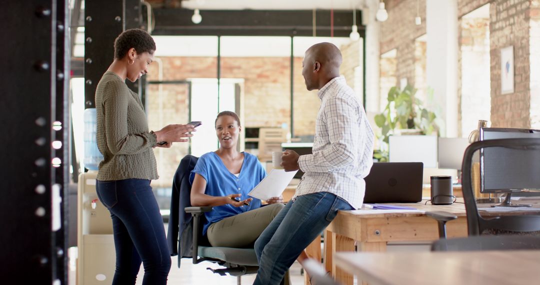 Team Collaboration Among Diverse Professionals in Modern Office Workspace