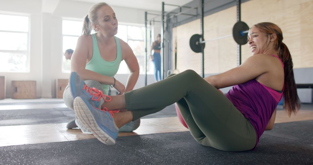 Personal Trainer Encourages Woman During Workout in Gym - Free Images, Stock Photos and Pictures on Pikwizard.com