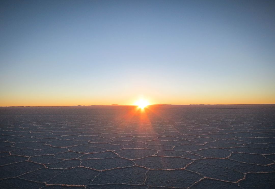 Sunrise over vast salt flats with clear sky - Free Images, Stock Photos and Pictures on Pikwizard.com