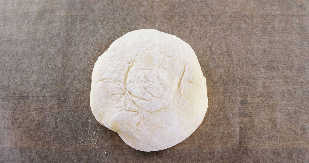 Round Ball of Fresh Dough on Parchment Paper - Free Images, Stock Photos and Pictures on Pikwizard.com