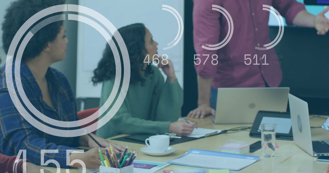 Business Team Analyzing Data Trends in Conference Room