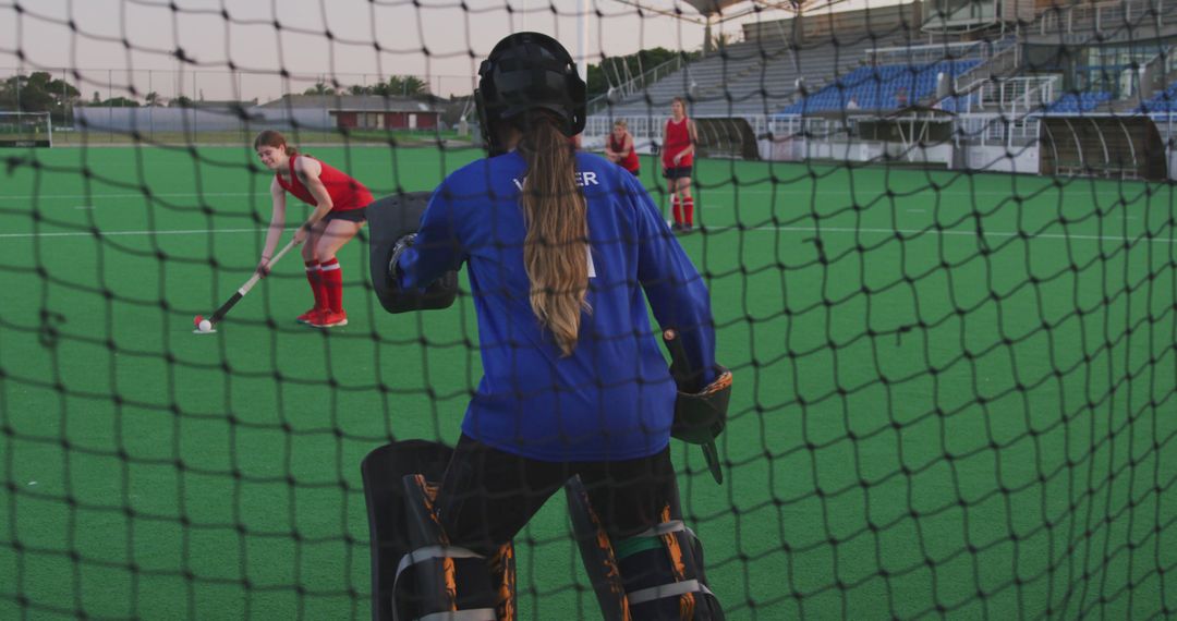 Women’s Field Hockey Goalie Preparing for Penalty Shot during Game - Free Images, Stock Photos and Pictures on Pikwizard.com