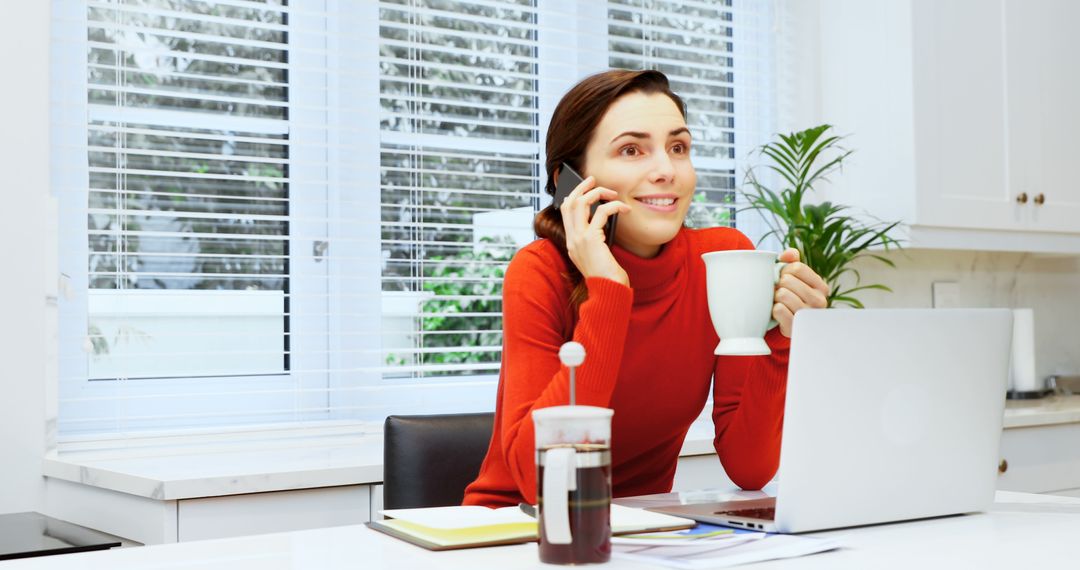 Woman Working from Home Talking on Phone with Coffee - Free Images, Stock Photos and Pictures on Pikwizard.com