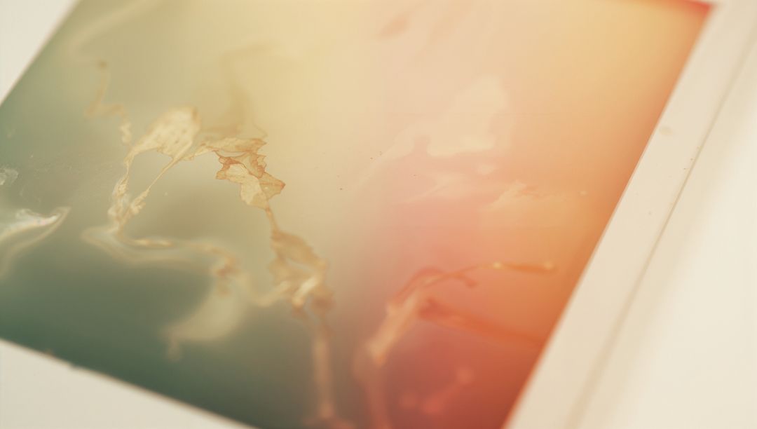 Glossy abstract art print featuring teal to peach gradient with gold foil veins on white mat