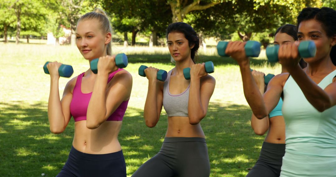 Group of Fit Women Exercising with Dumbbells in Park - Free Images, Stock Photos and Pictures on Pikwizard.com