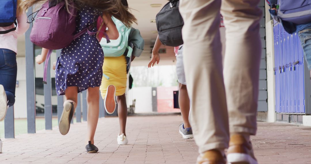 Teacher and Diverse Students Running at School for Excitement