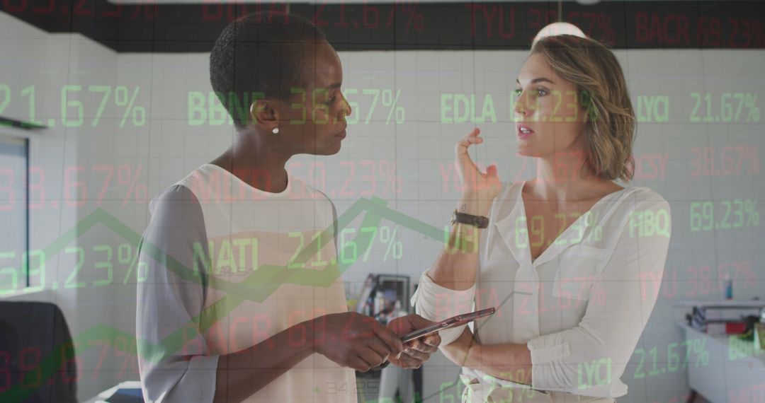 Diverse Coworkers Discuss Financial Data in Modern Office