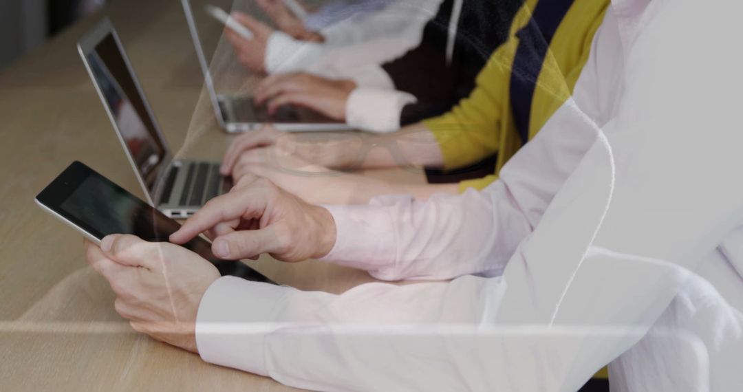 Team Collaboration with Laptops and Tablets in Office