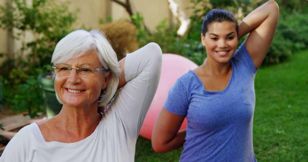 Senior Woman and Young Woman Stretching Arm Muscles Together Outdoors - Free Images, Stock Photos and Pictures on Pikwizard.com