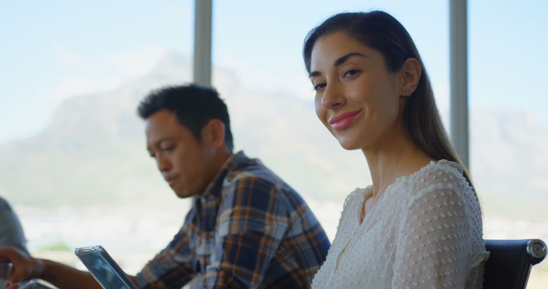 Smiling Female Executive Using Digital Tablet in Modern Office