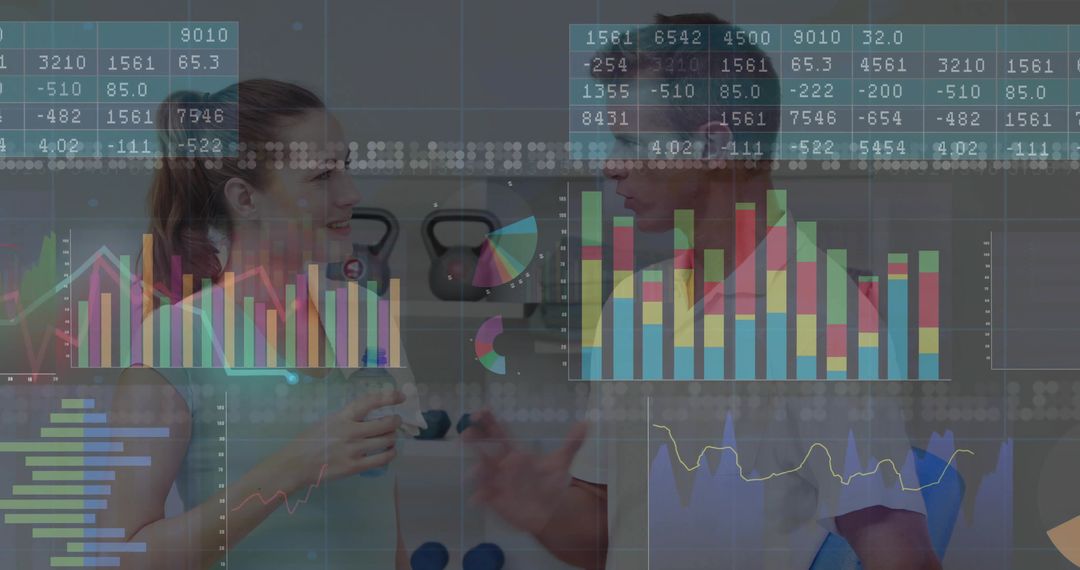 Fitness Trainer and Client Analyzing Health Data in Gym