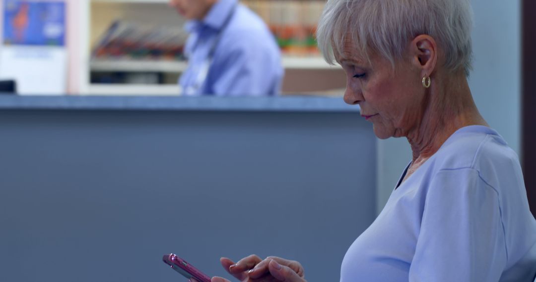 Senior Woman Using Smartphone in Waiting Room - Free Images, Stock Photos and Pictures on Pikwizard.com