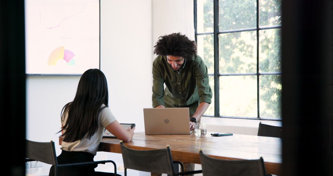 Collaboration in Modern Office Setting with Diverse Team Members