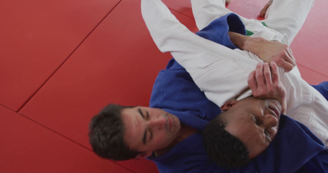 Two Men Grappling in Brazilian Jiu-Jitsu Training Session - Free Images, Stock Photos and Pictures on Pikwizard.com