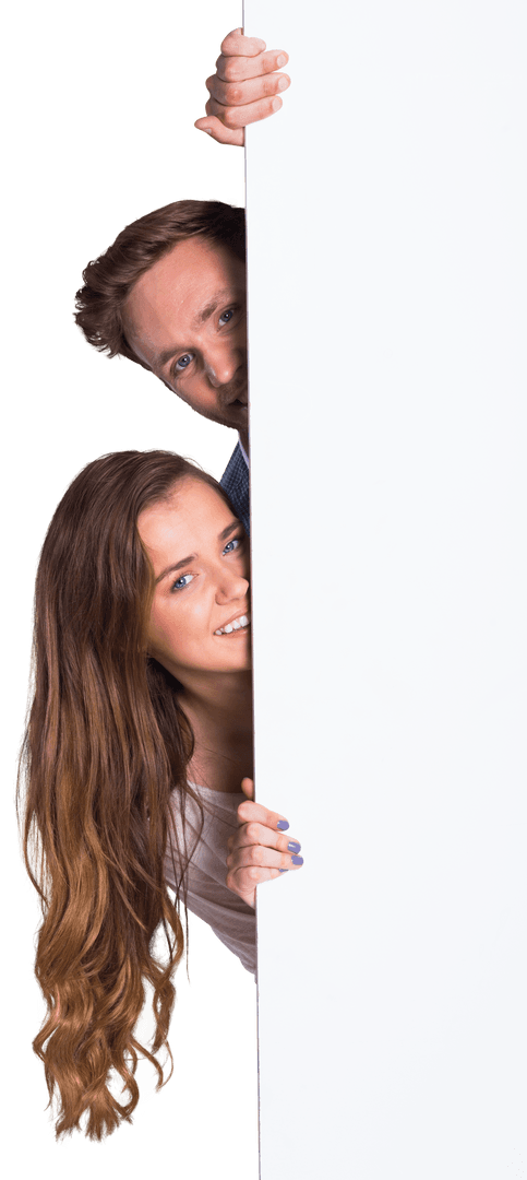 Playful Young Couple Peeking from Behind Transparent Blank Board