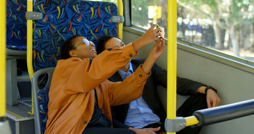 Friends Taking Selfie on Bus Ride with Relaxed Atmosphere - Free Images, Stock Photos and Pictures on Pikwizard.com