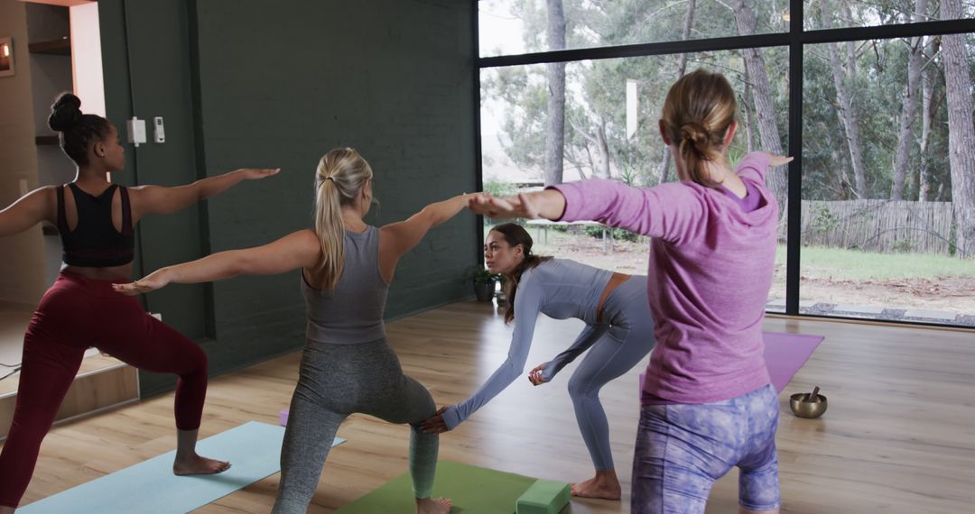 Diverse Women Practicing Yoga Inside Serene Studio - Free Images, Stock Photos and Pictures on Pikwizard.com