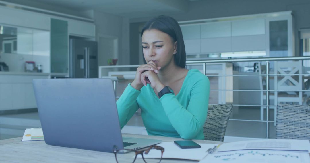 Remote Worker Focusing on Laptop at Home Workspace