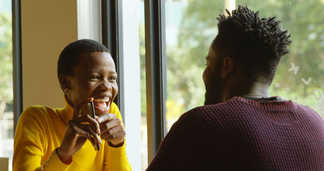 Joyful Conversation Over Coffee with Smiling Friends
