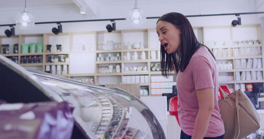 Customer and Assistant Conversing at Bakery Counter