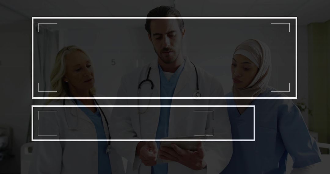 Diverse Medical Team Discussing Patient Information in Hospital Corridor