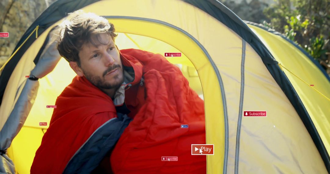Man Relaxing in Sleeping Bag at Forest Campsite