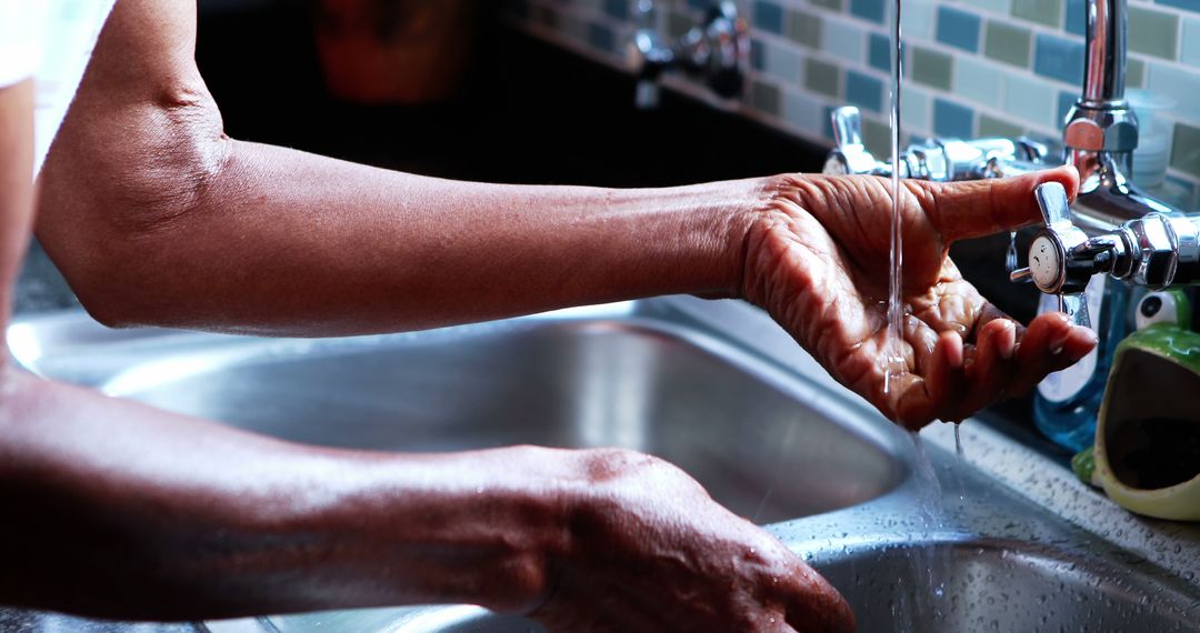 Close-up of Person's Hands Washing in Kitchen Sink with Running Water - Free Images, Stock Photos and Pictures on Pikwizard.com