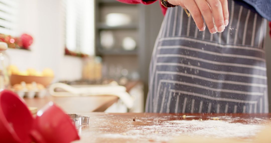 Close-Up of Person Baking in Kitchen, Sprinkling Flour - Free Images, Stock Photos and Pictures on Pikwizard.com