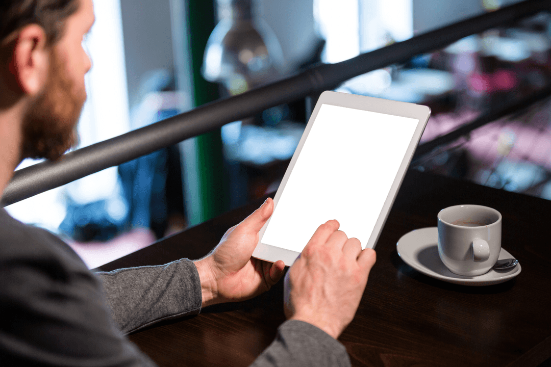 Man Holding Tablet at Cafe with Transparent Background