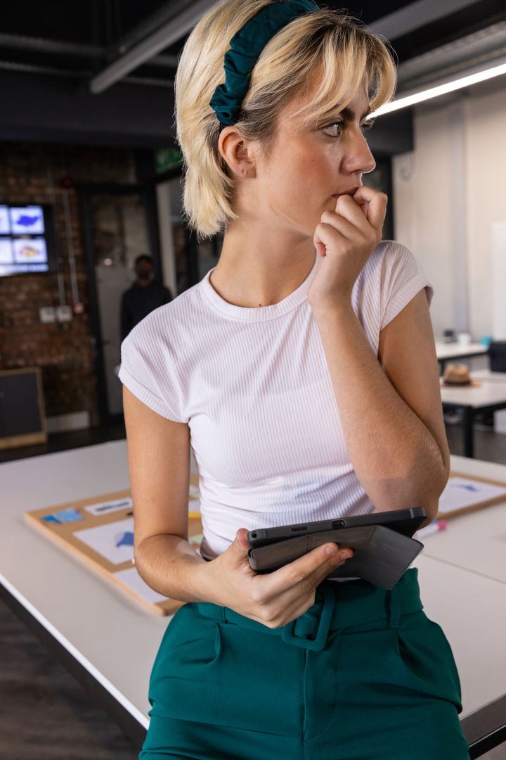 Attentive Professional in Modern Creative Workspace
