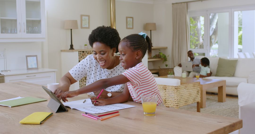 Mother and Daughter Engaging in Art Activity at Home
