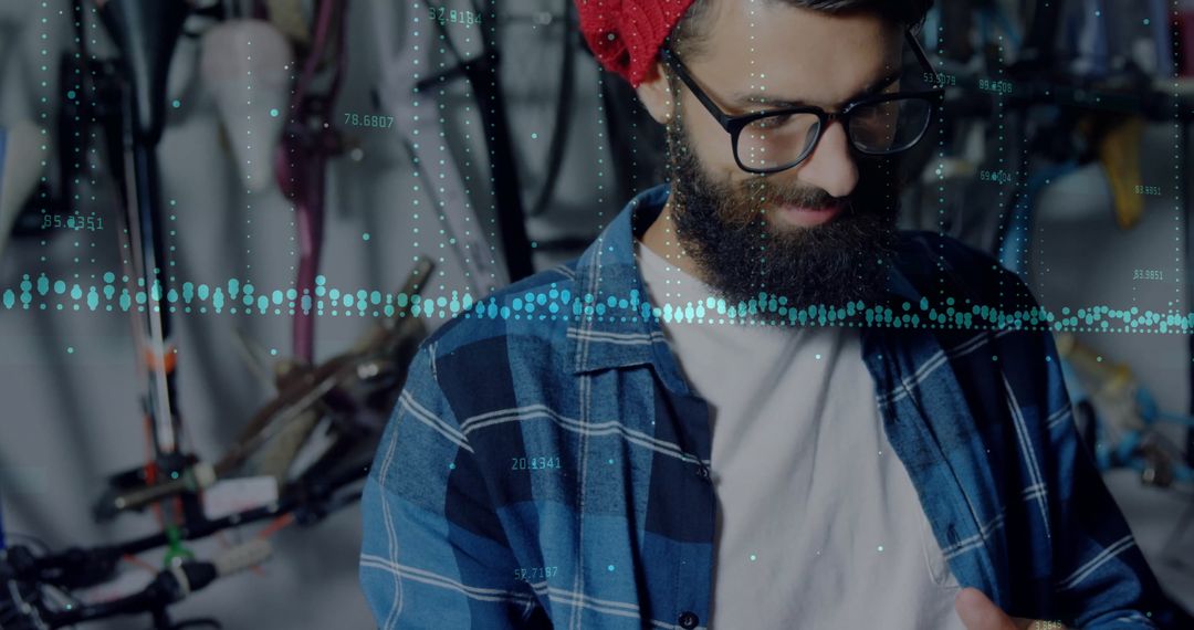 Bearded Man Using Tablet with Data Overlay in Professional Setting