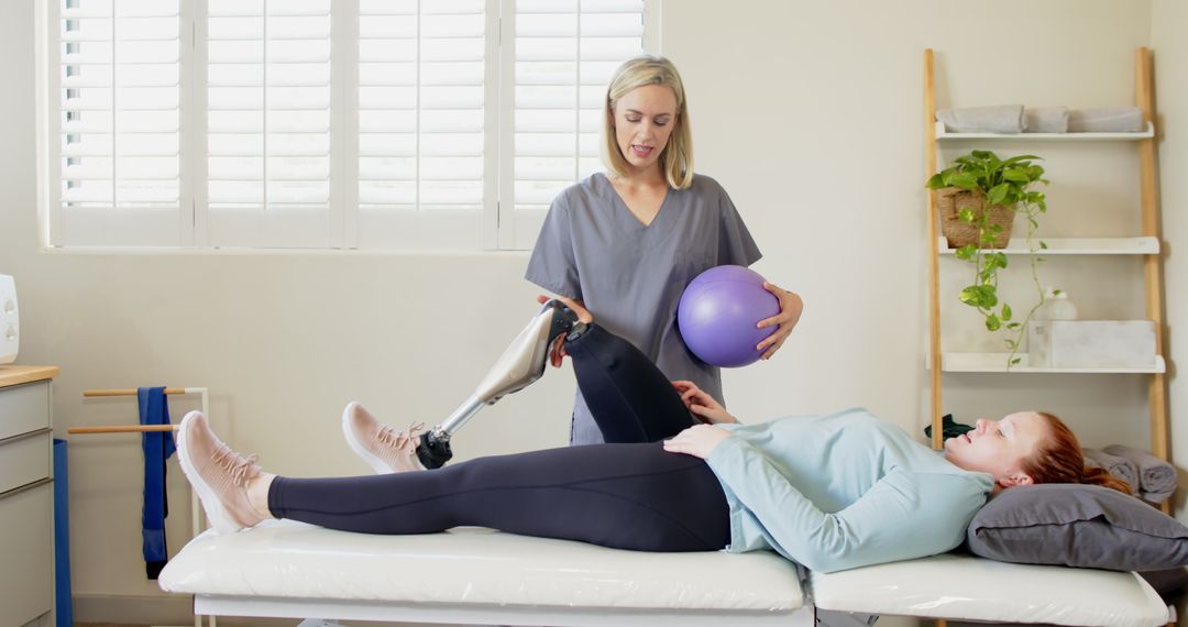 Physical Therapist Assisting Patient with Exercise Ball Therapy Session