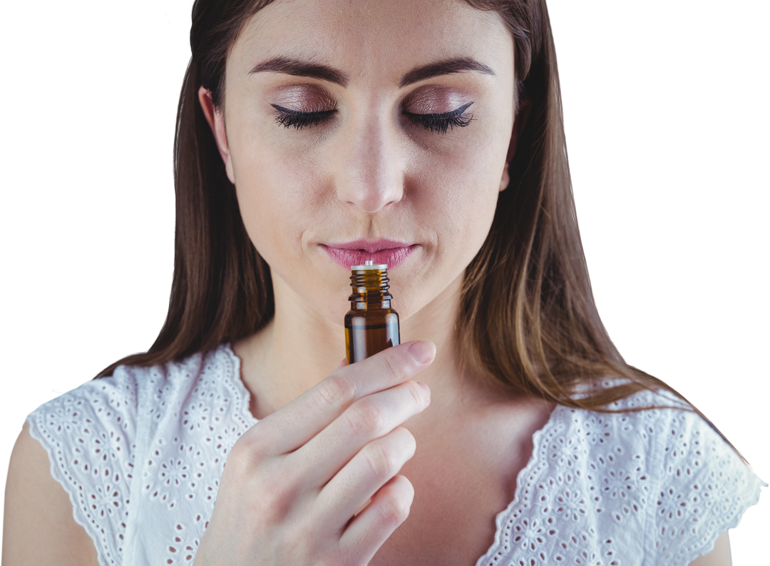 Woman Smelling Transparent Essential Oil Bottle - Download Free Stock Images Pikwizard.com