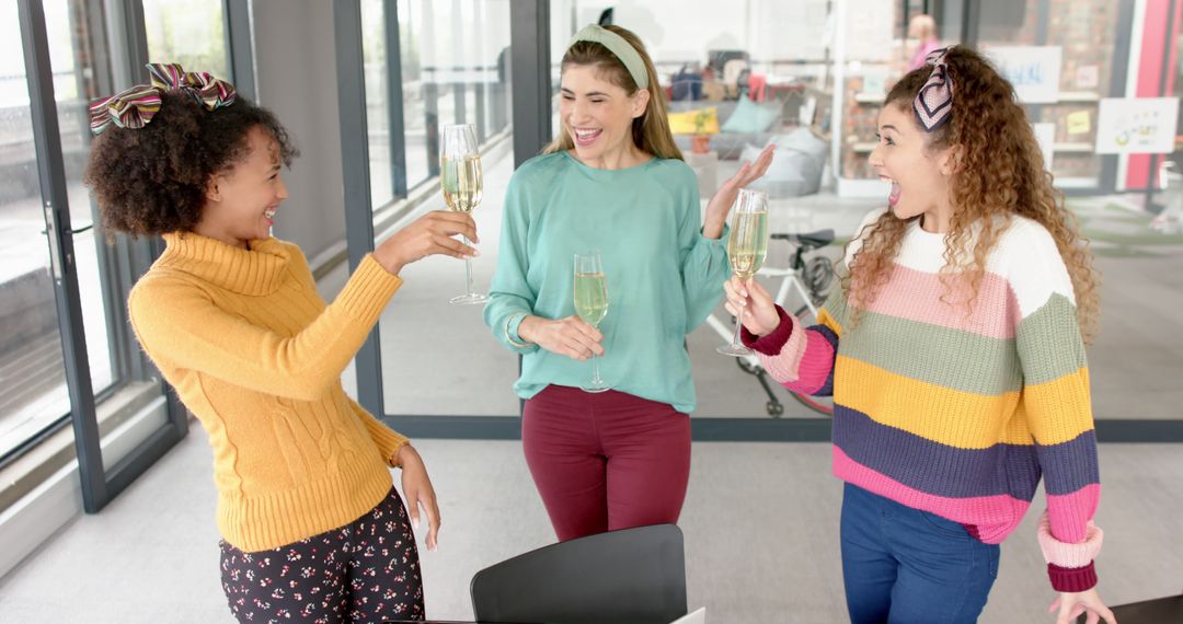 Group of Women Celebrating with Champagne at Office - Free Images, Stock Photos and Pictures on Pikwizard.com