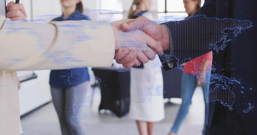 Business partners shaking hands over digital world map representing global partnership