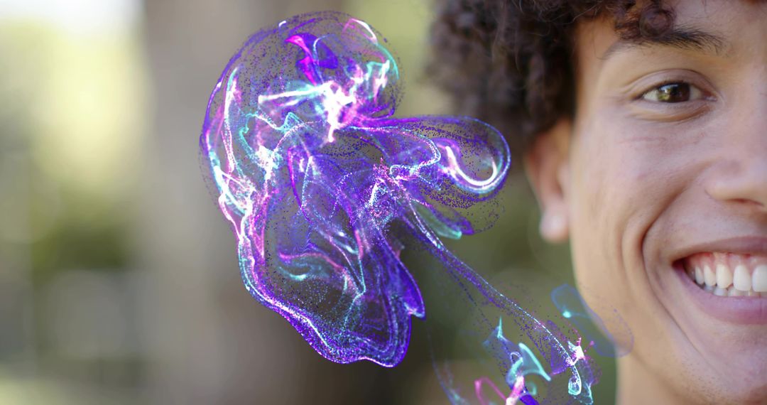 Smiling man discovering glowing neon jellyfish hologram outdoors with bokeh