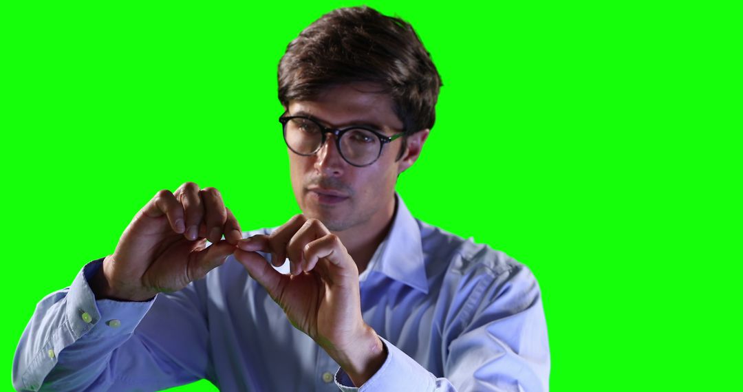 Young Man Inserting Contact Lenses with Green Background - Free Images, Stock Photos and Pictures on Pikwizard.com