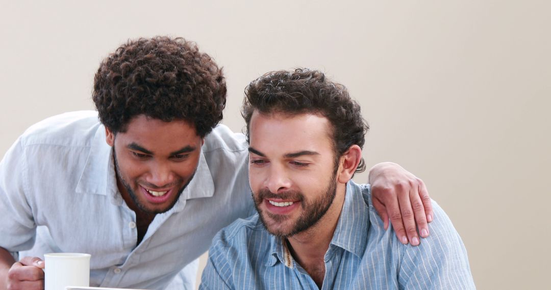 Two Men Enjoying Coffee Break Together in Office Environment - Free Images, Stock Photos and Pictures on Pikwizard.com