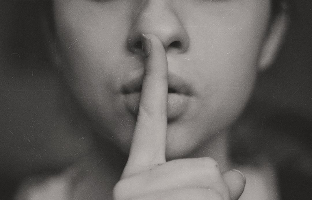 Close-Up Shot of Person Gesturing Silence With Finger on Lips - Free Images, Stock Photos and Pictures on Pikwizard.com