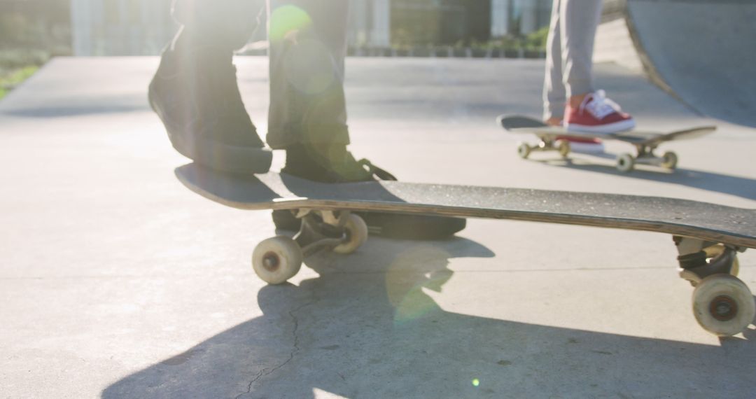 Feet of Two Skaters Practicing Tricks at Skatepark - Free Images, Stock Photos and Pictures on Pikwizard.com