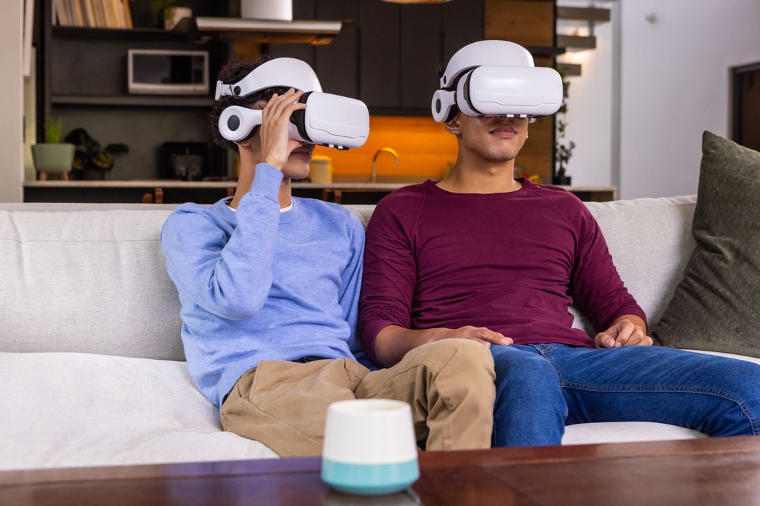 Friends Enjoying VR Experience on Sofa with Smart Speaker Nearby