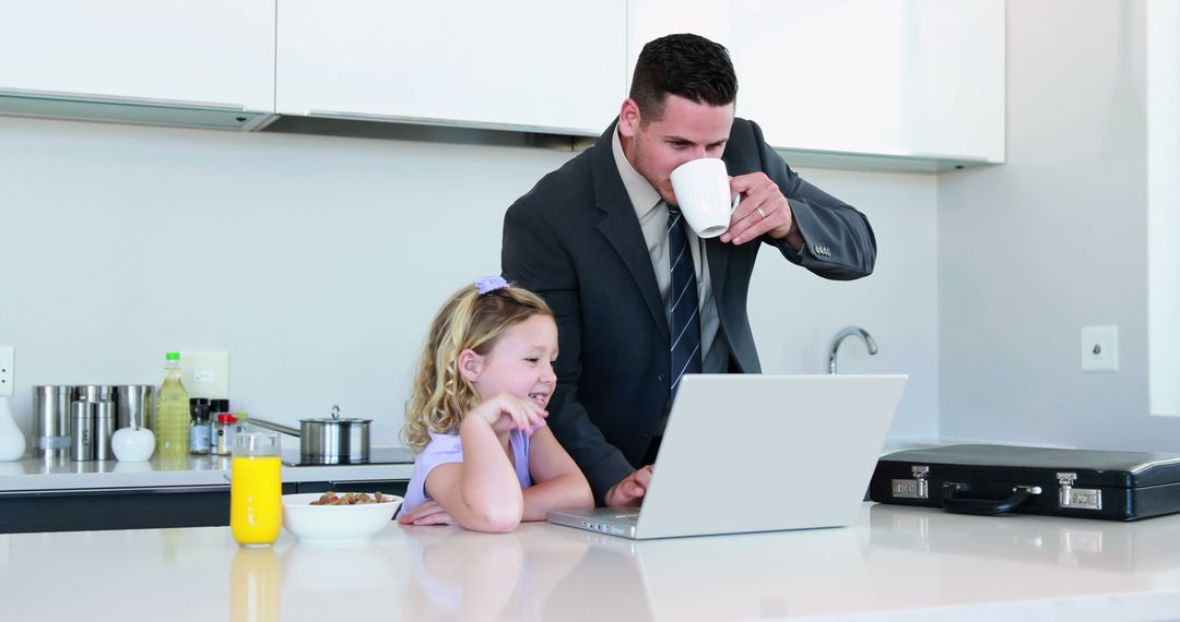 Businessman Working from Home with Daughter Laughing - Free Images, Stock Photos and Pictures on Pikwizard.com