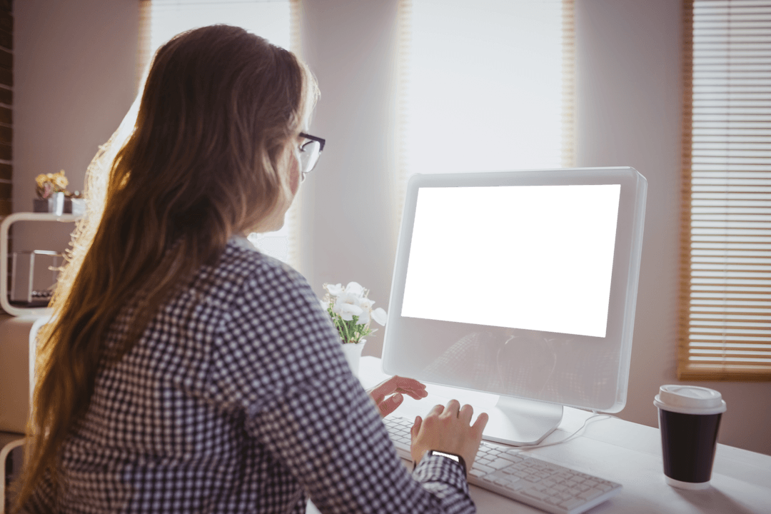 Transparent Computer Display with Businesswoman in Office